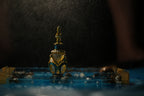 Decorative bottle with intricate design on a dark background