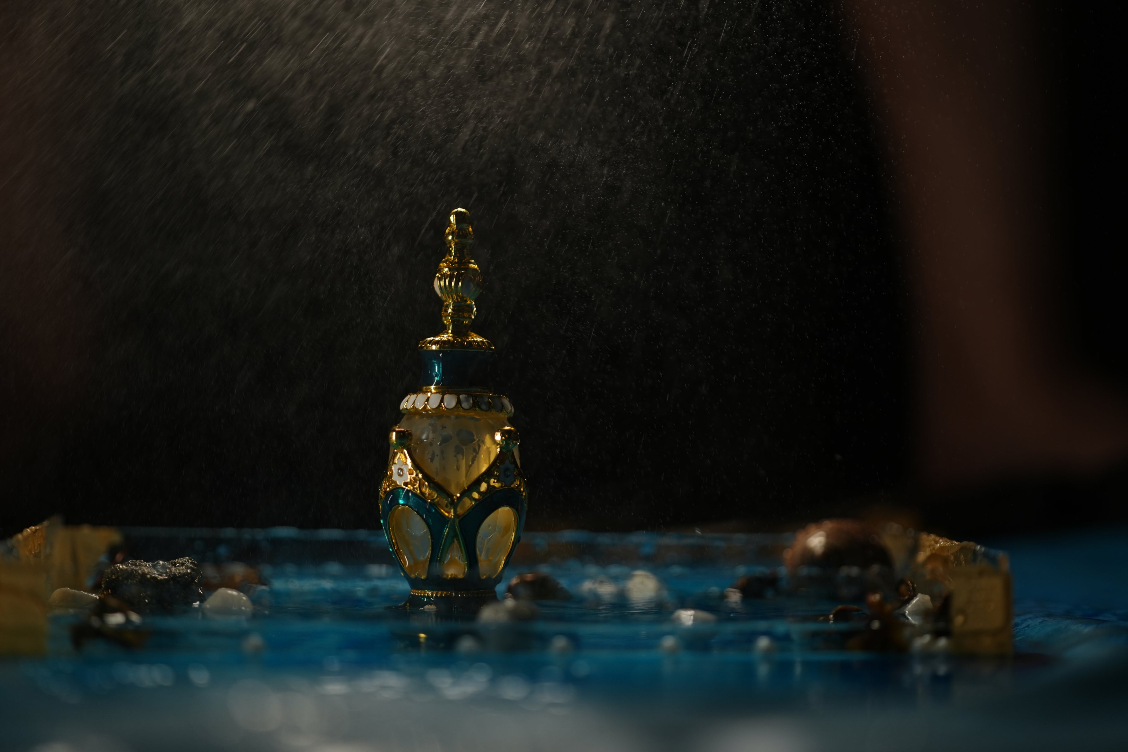 Decorative bottle with intricate design on a dark background